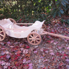 Unfinished and ready to paint, and with custom back rest and safety side rails